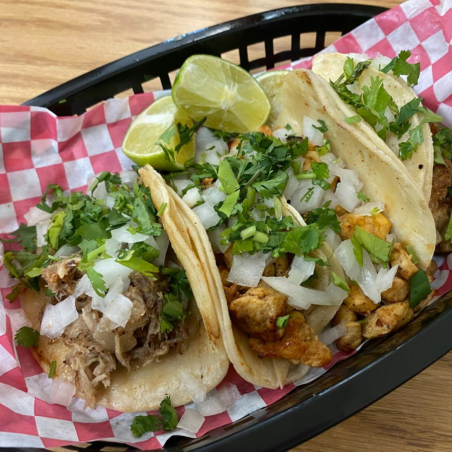 Tacos with fresh toppings, shown as real stock photography for the sample menu